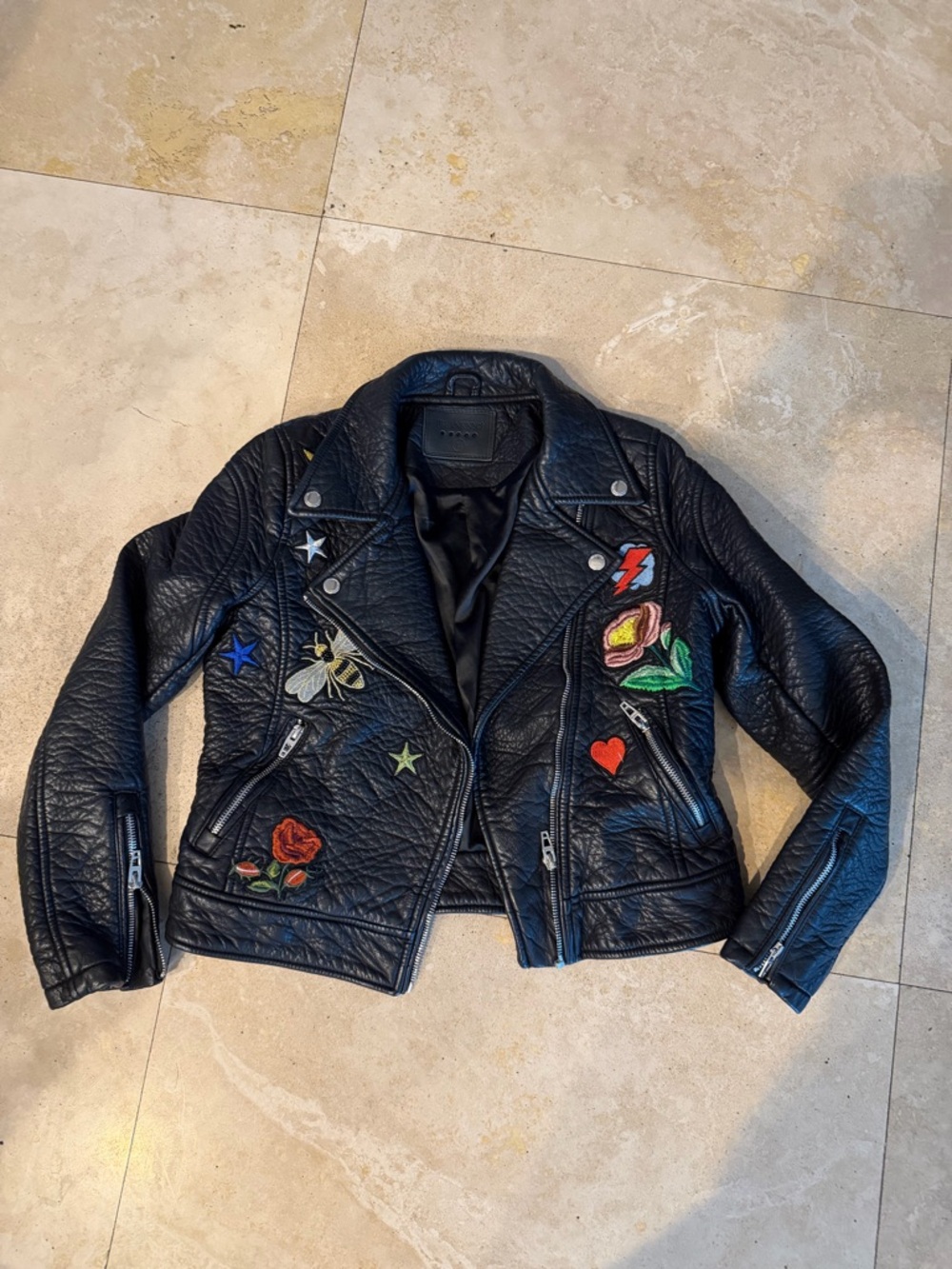 Blank NYC vegan leather jacket girls size 10-12
With embroidery